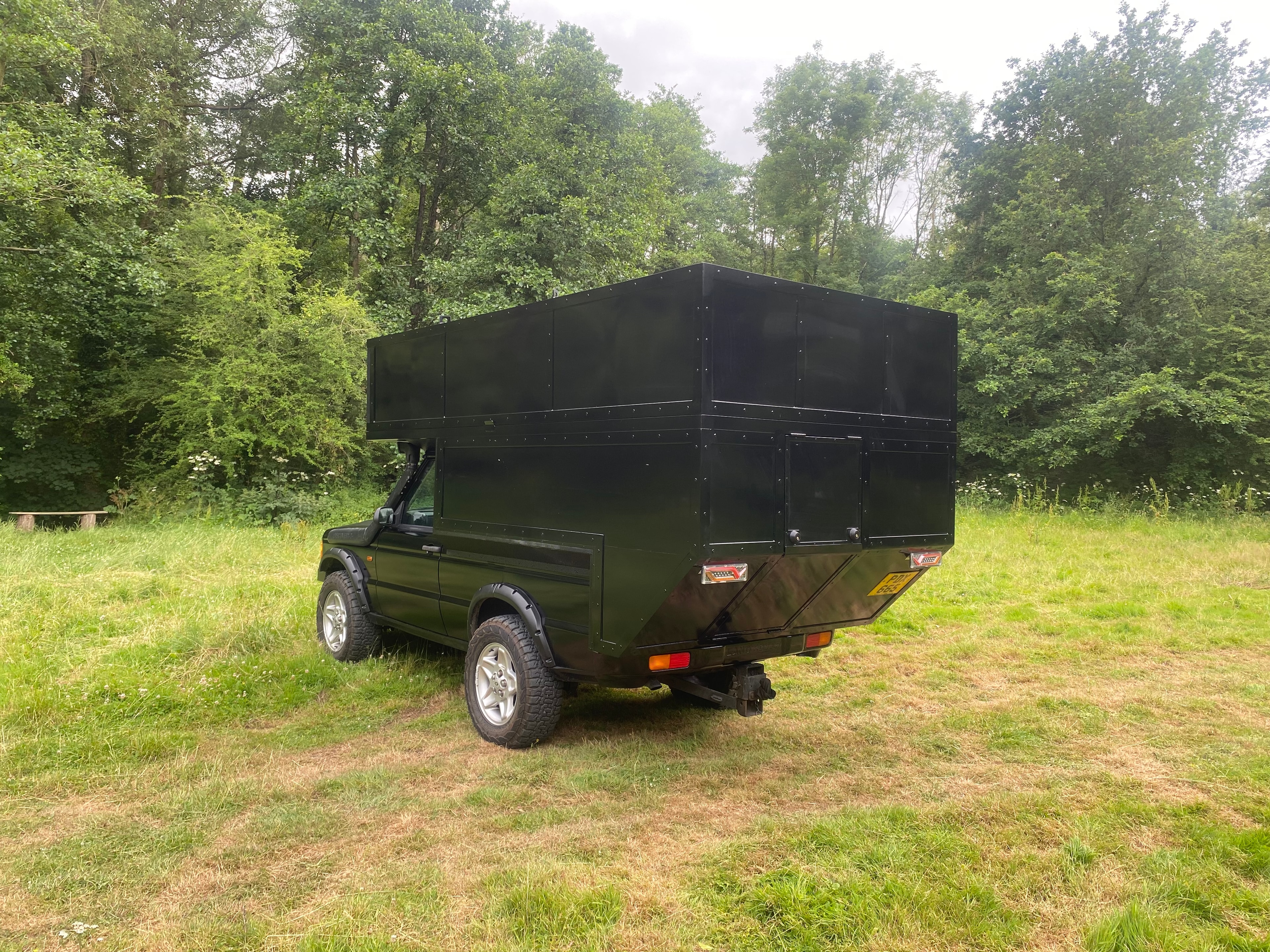The Highlander — rear view, olive finish