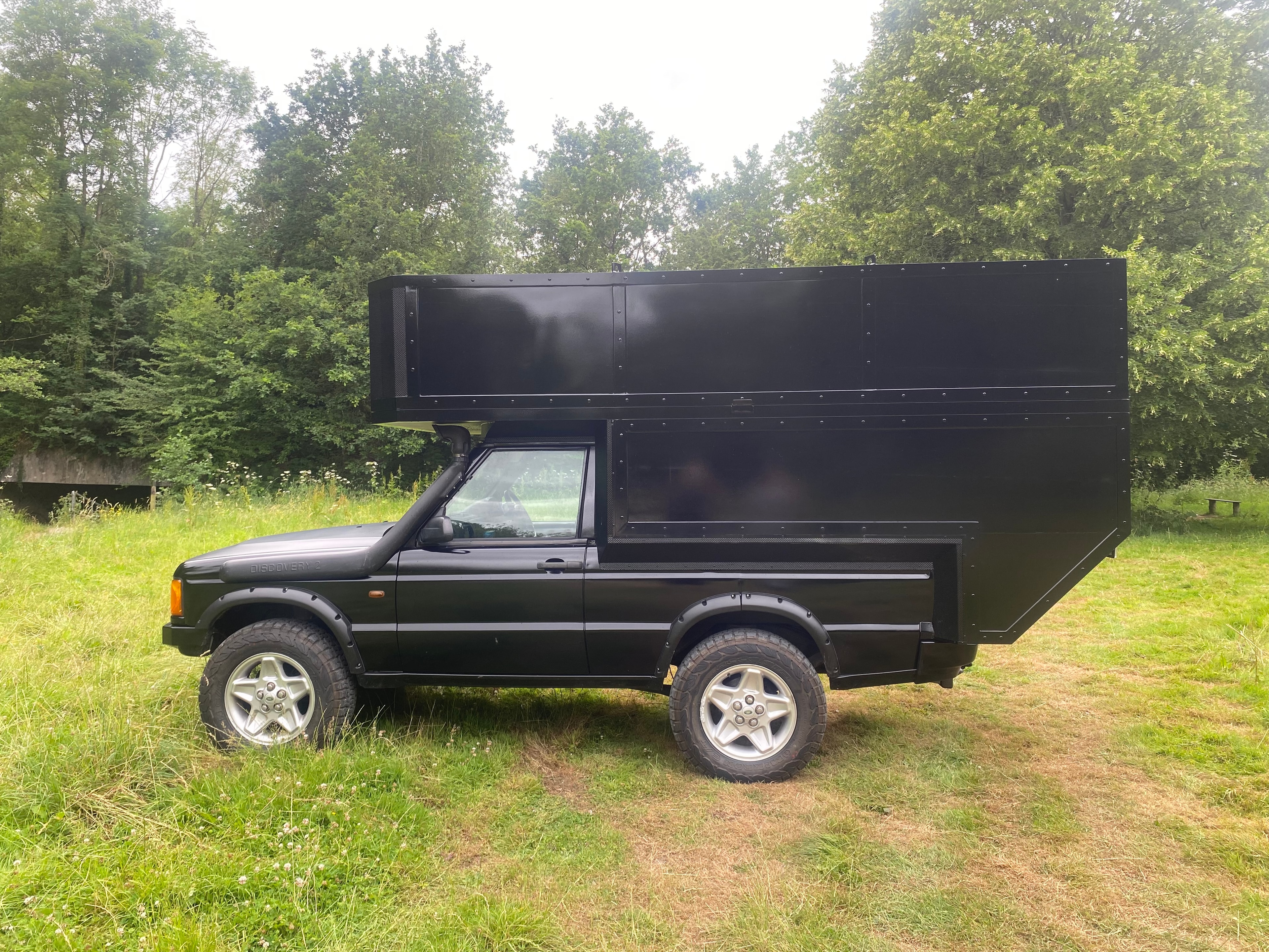 The Highlander — side profile, summer green